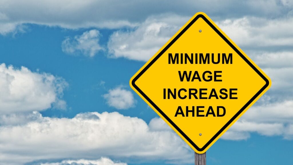 A sign saying 'minimum wage increase ahead'