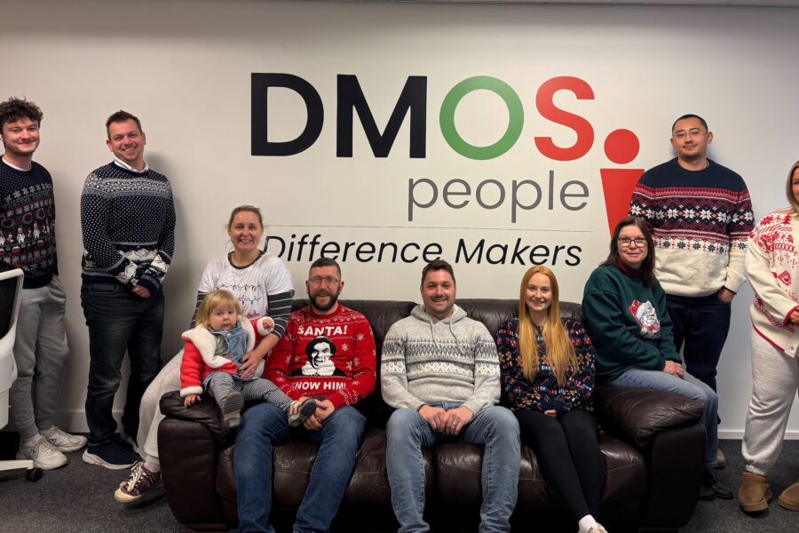 The DMOS People team wearing Christmas jumpers